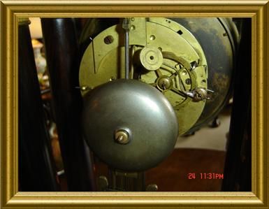   wood inlaids & very ornated pendulum,withe key and working. A TRUE