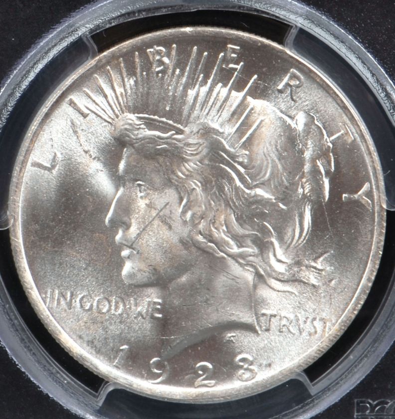 This is a 1923 Peace Silver Dollar graded and authenticated by PCGS in 