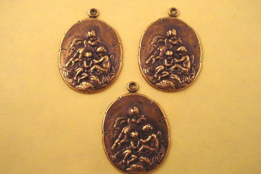 brass ox angel cherubs scenes charms pendants  