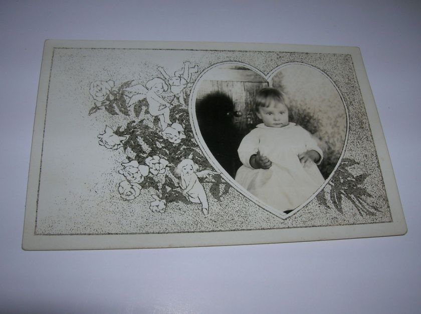   Mortem Baby in heart rppc postcard with angels and flowers off to side